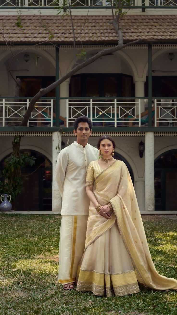 Couple in cream Kerala attire with golden kasavu border